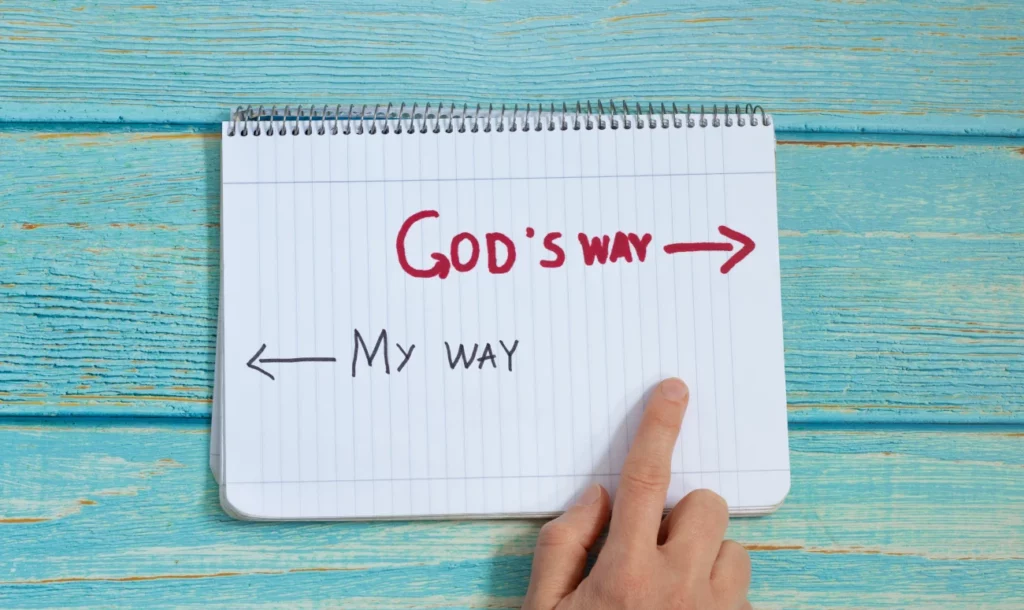An image of a finger pointing between the words God's way and my way.